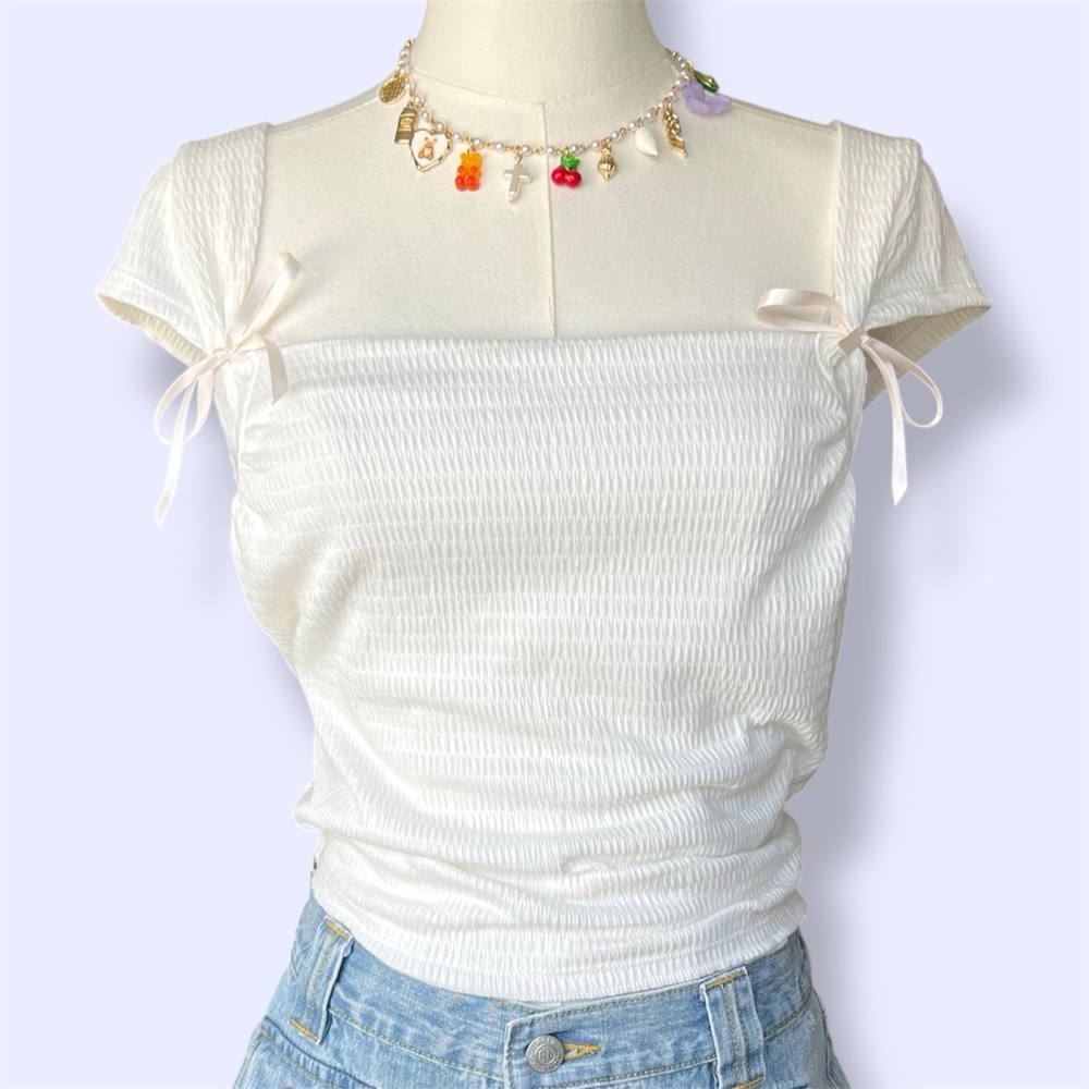 Urban Outfitters white cap sleeve pink bow detail top